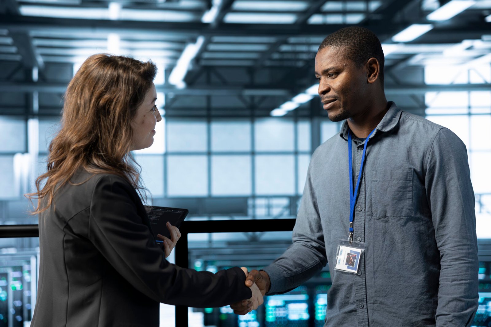 Data center admin meeting with supervisor verifying workspace security